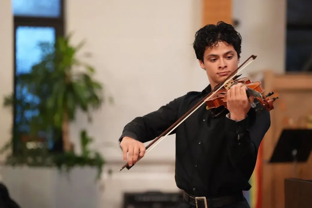 Yoseph Holland performing violin